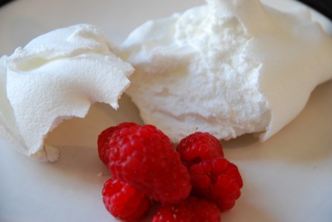 Meringue - made from eggs served with raspberries