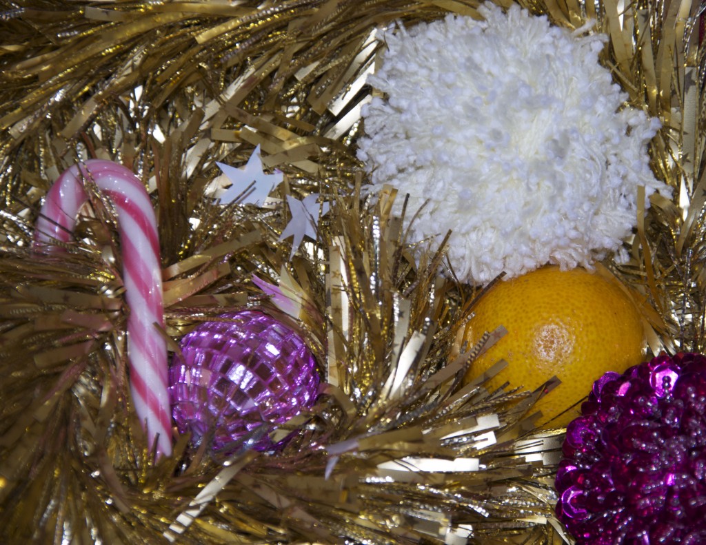 white pom pom, orange, candy cane and Christmas decorations for a preschool science activity