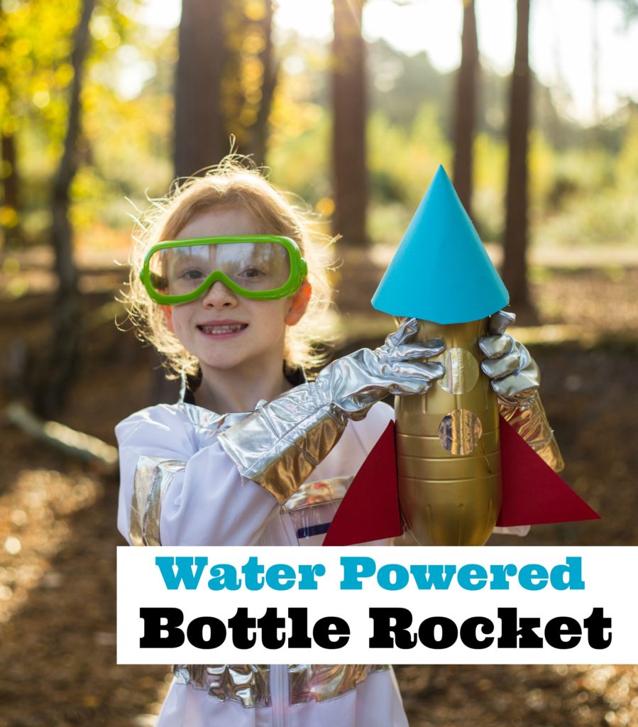 Child holding a rocket made from a plastic bottle for a science experiment