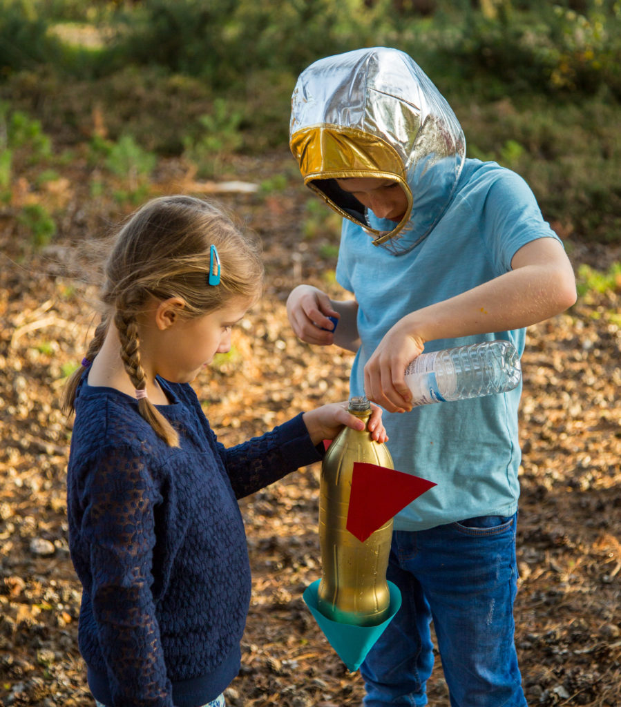 kids launching a water bottle rocket