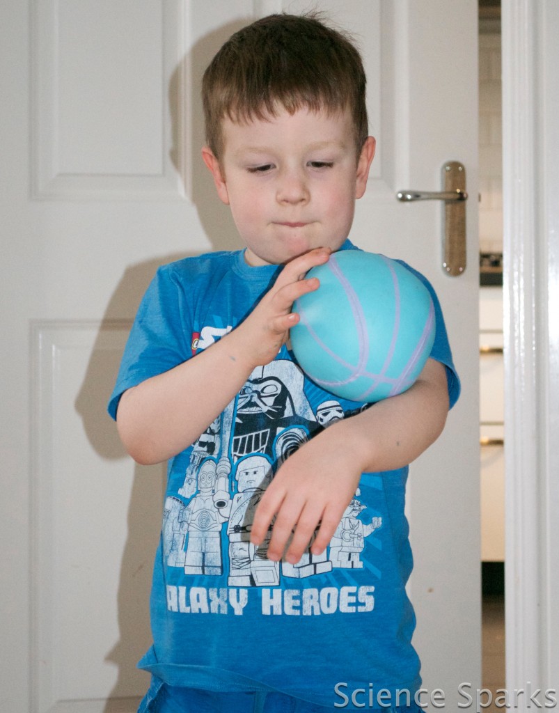 Young boy holding a ball