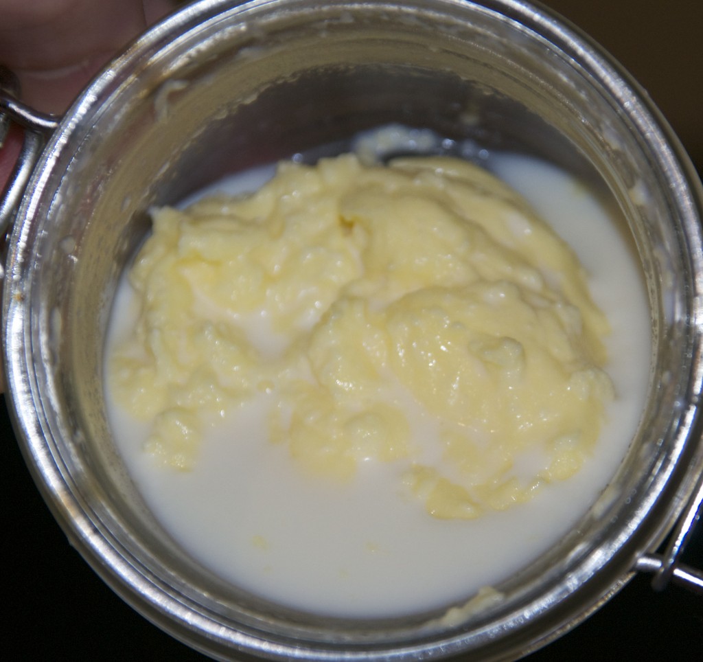 Cream starting to curdle into butter - Butter in a jar - kitchen science for kids