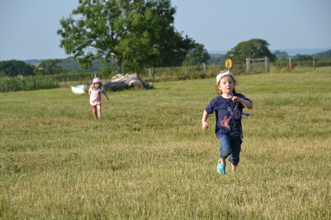 Children running in a field