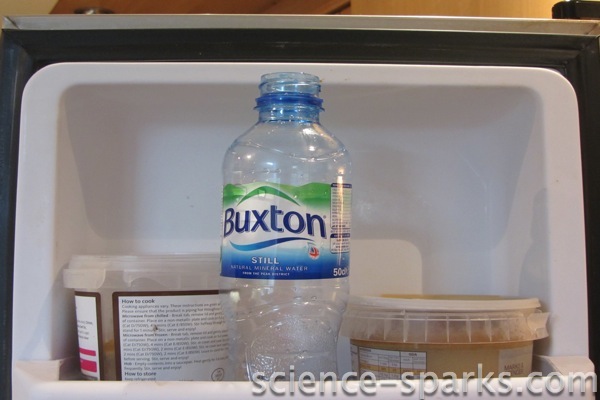 Bottle of water in a freezer