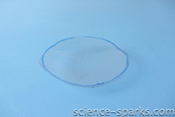 Magnifying glass made from a plastic bottle