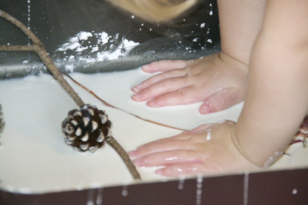 cornflour gloop with pinecones and leaves