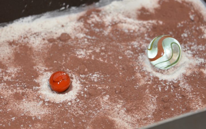 Crater experiment with marbles and flour