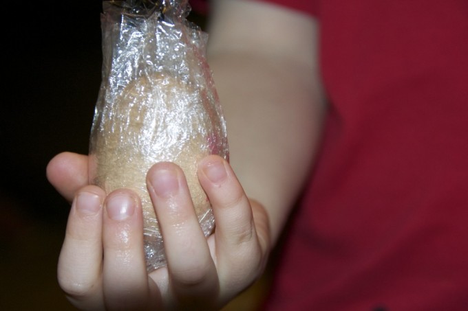 egg wrapped in cling film for an unbreakable egg demonstration