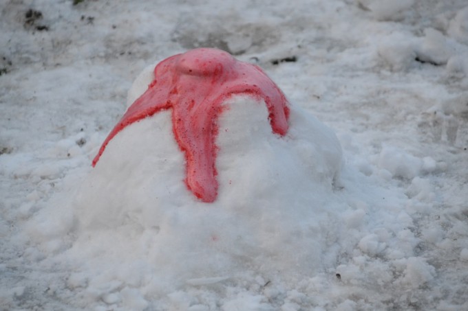 Baking soda snow Volcano with red baking soda and vinegar lava erupting from the top