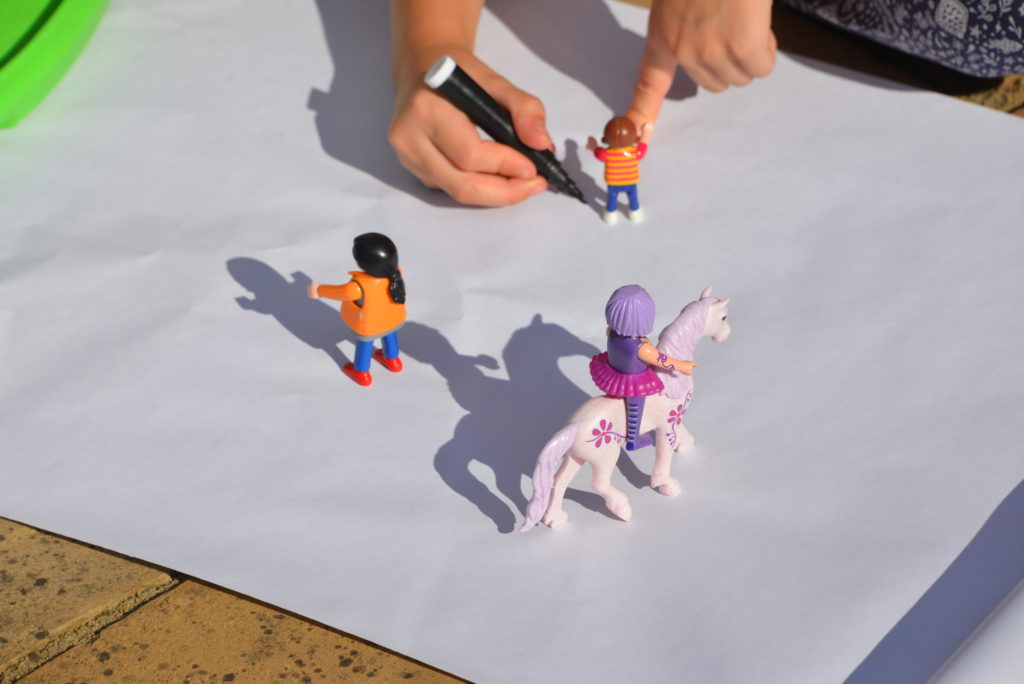Shadow drawings made using plastic toys - fun shadow activity for kids