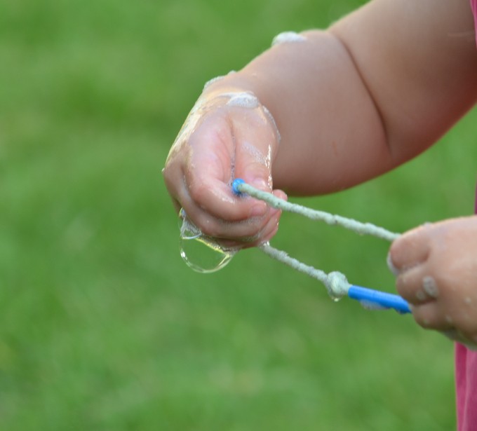 Homemade bubble wand made using thick string and straws