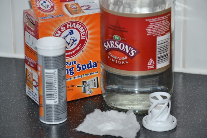 vinegar, baking soda and a small container for making baking soda rockets
