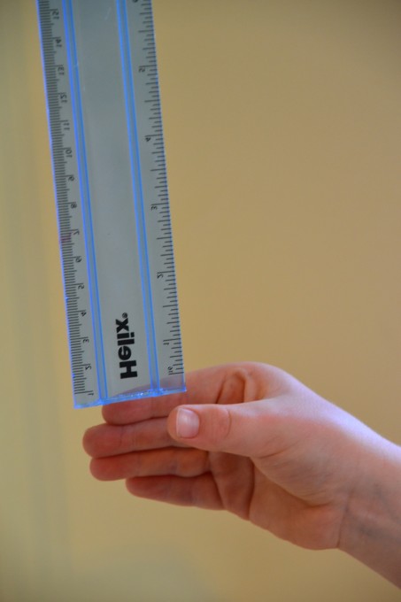 Hand about to catch a ruler for a reaction time test
