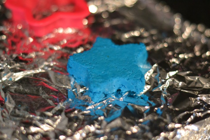 Plastic milk made from the curds of milk. The curds have been coloured blue with food colouring, made into a star shape and left to harden.