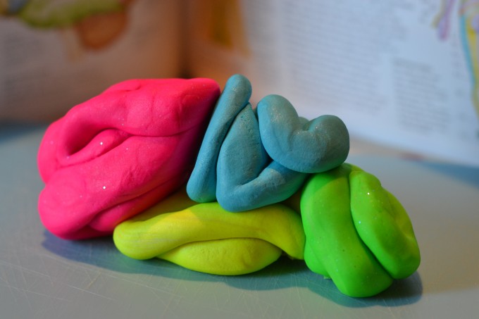 Model Brain made with play dough, using a different colour dough for each hemisphere.
