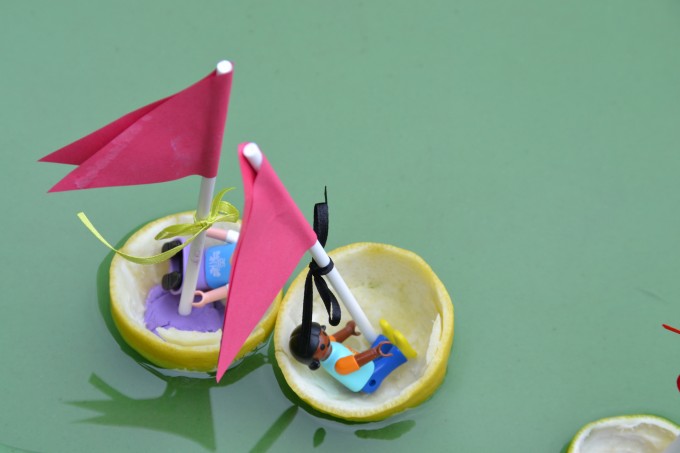 lemon boats with playmobil people inside for a sink and float science experiment