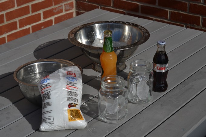 bowl, ice, salt, glasses and drinks it bottles ready to chill with ice and salt.