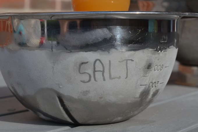 condensation on the side of a metal bowl with the word SALT written on the side
