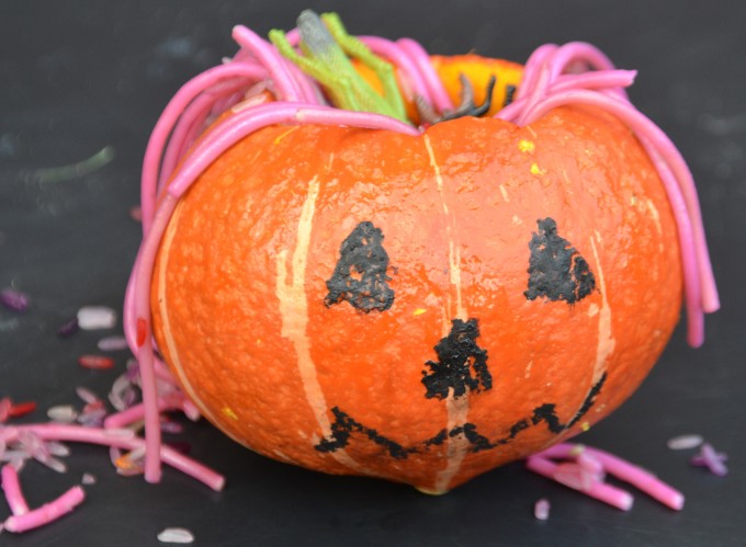 pumpkin with slimy coloured spaghetti inside for a Halloween game