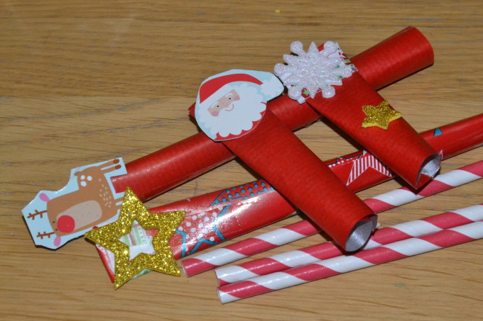 paper straws and wrapping paper for a Christmas STEM challenge
