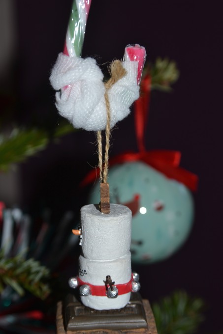 Candy cane strengthened with a bandage for a science experiment.