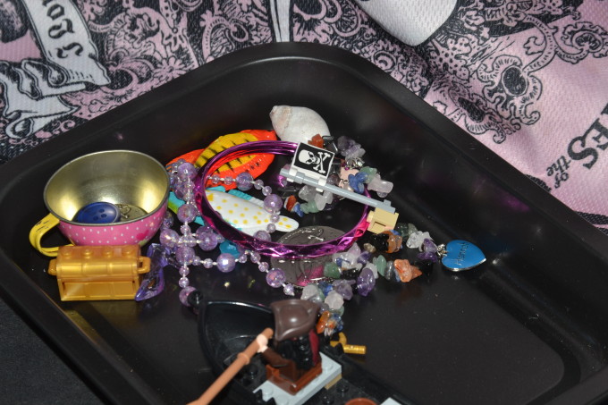 pirate treasure in a container ready for a sink or float preschool science investigation