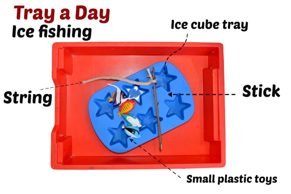 ice fishing - Tray a Day
A red tray with an ice cube tray, plastic small fish and a stick with a small piece of string attached inside