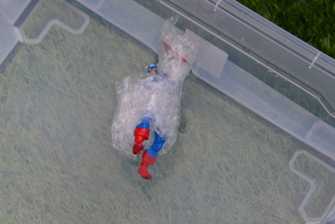 superman wrapped in bubble wrap for a science activity
