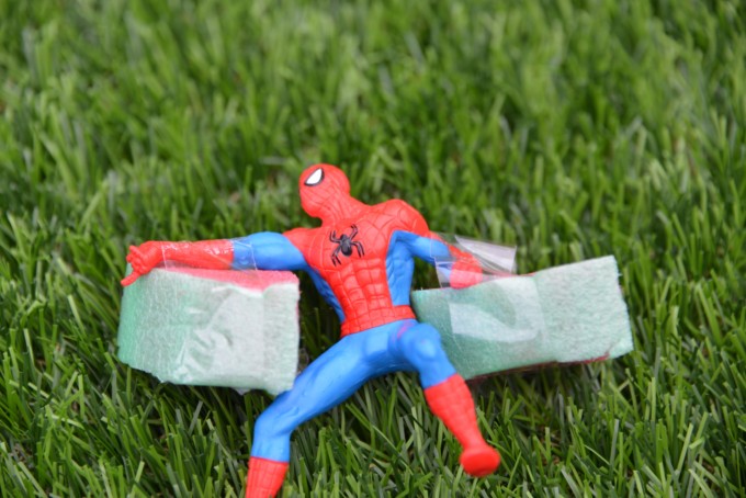 spiderman wearing pool noodle arm bands for a buoyancy science experiment