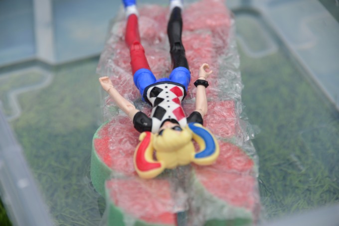superhero floating on a DIY float for a science activity