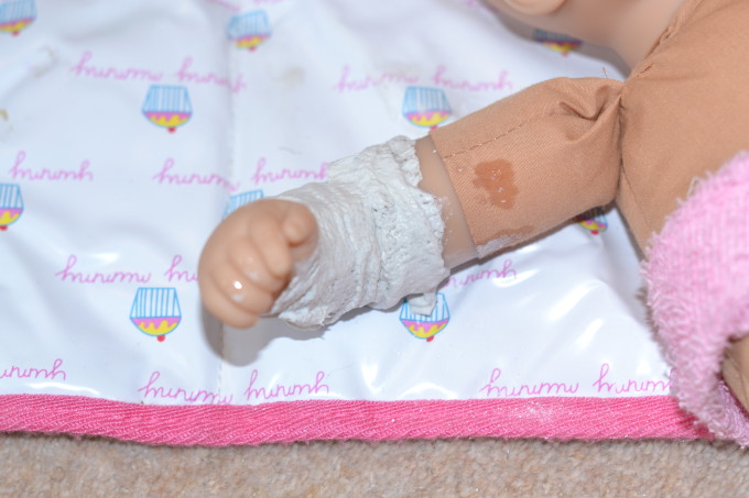 modroc used to make a plaster cast for a doll. A great doctor role play activity idea.