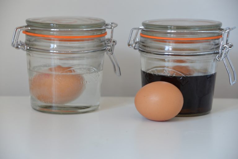 boiled eggs soaking in vinegar and water for a tooth decay demonstration