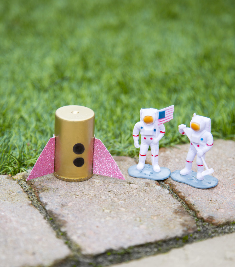 Film Canister rocket and two toy astronauts