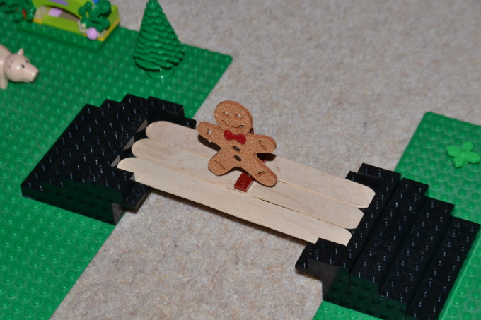 Bridge for the gingerbread man made from craft sticks for a book themed STEM challenge