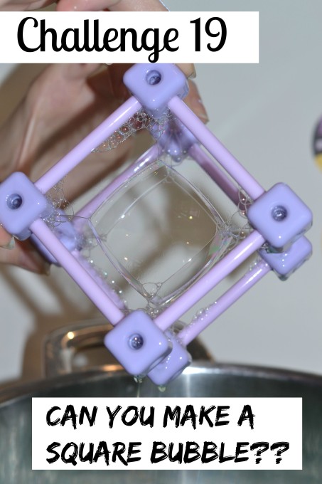 Square bubbles inside a cube frame.