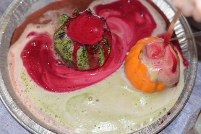 Fizzy pumpkins made with hollowed out pumpkins, baking soda, food colouring and vinegar