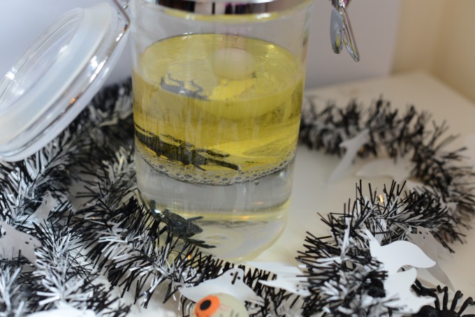 Spooky Halloween Density Jar - glass jar half filled with oil and water