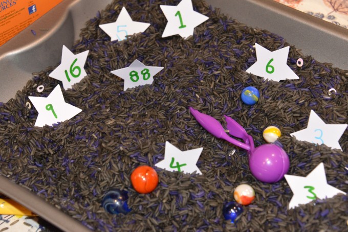 space themed sensory rice bin