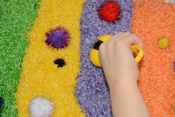 Willy Wonka Sensory tub made with coloured rice and pom poms