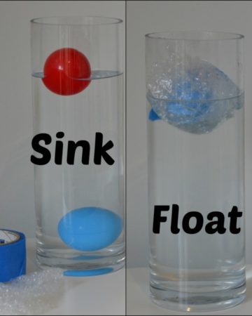 two balls in a large cylindrical container. One ball sinks, but then floats when wrapped in bubble wrap to reduce the density