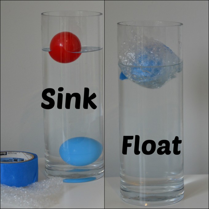 two balls in a large cylindrical container. One ball sinks, but then floats when wrapped in bubble wrap to reduce the density