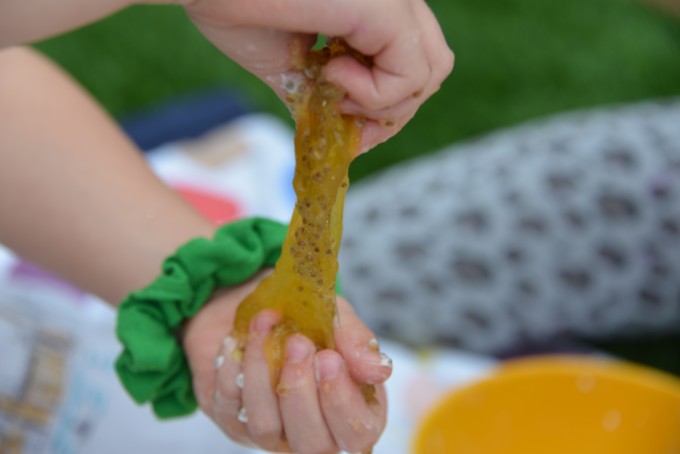 Fybogel slime - no borax slime recipe. Image shows a child stretching the slime with their hands