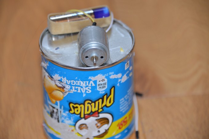 Step 2 - how to make an Art Bot - battery held in place with an eleastic band and a motor attached