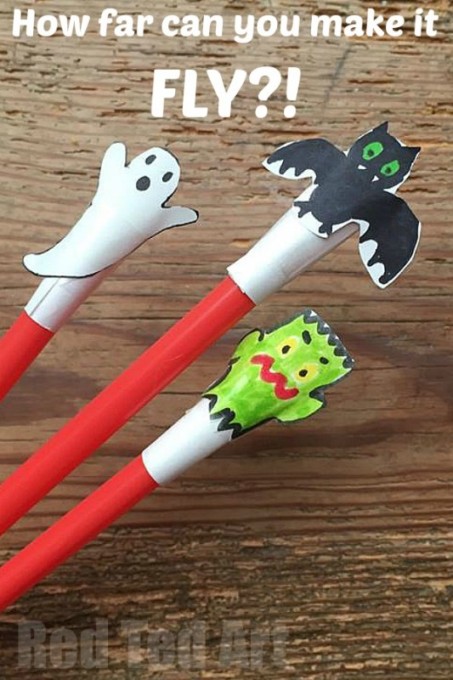 Halloween themed straw toy shooters made with paper and straws