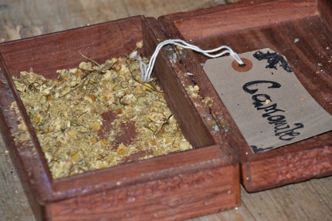 witchy-herbs in a wooden container