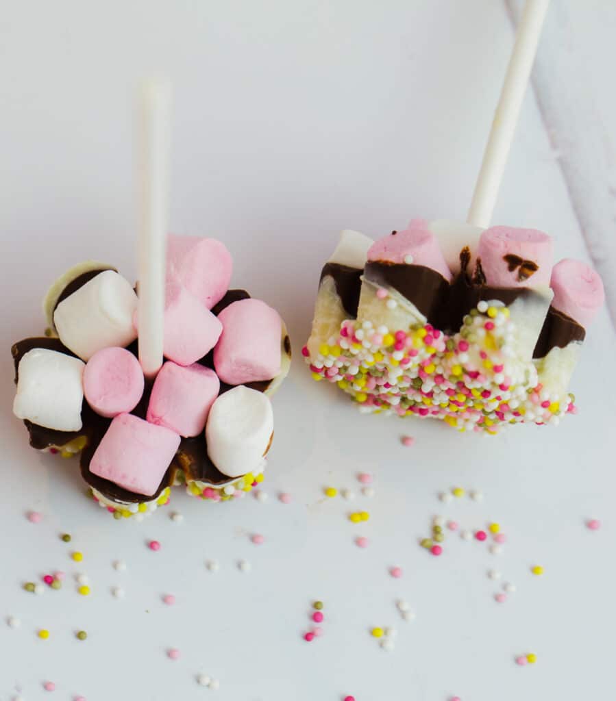 homemade hot chocolate sticks with sprinkles and marshmallows