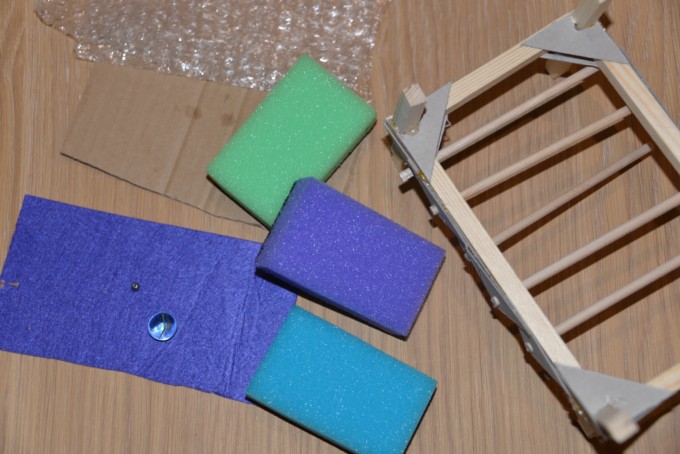 sponges and a mini wooden bed frame for a Princess and the Pea STEM challenge