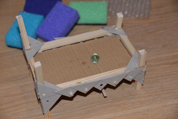 mini wooden bed frame for a Princess and the pea activity