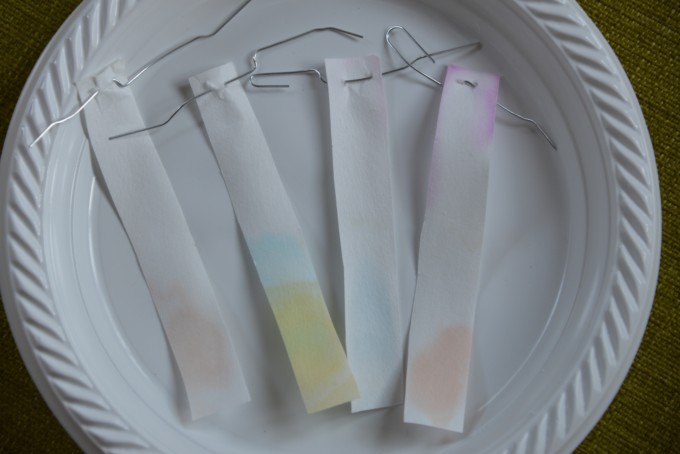 Filter paper after using chromatography to separate different colours in candy