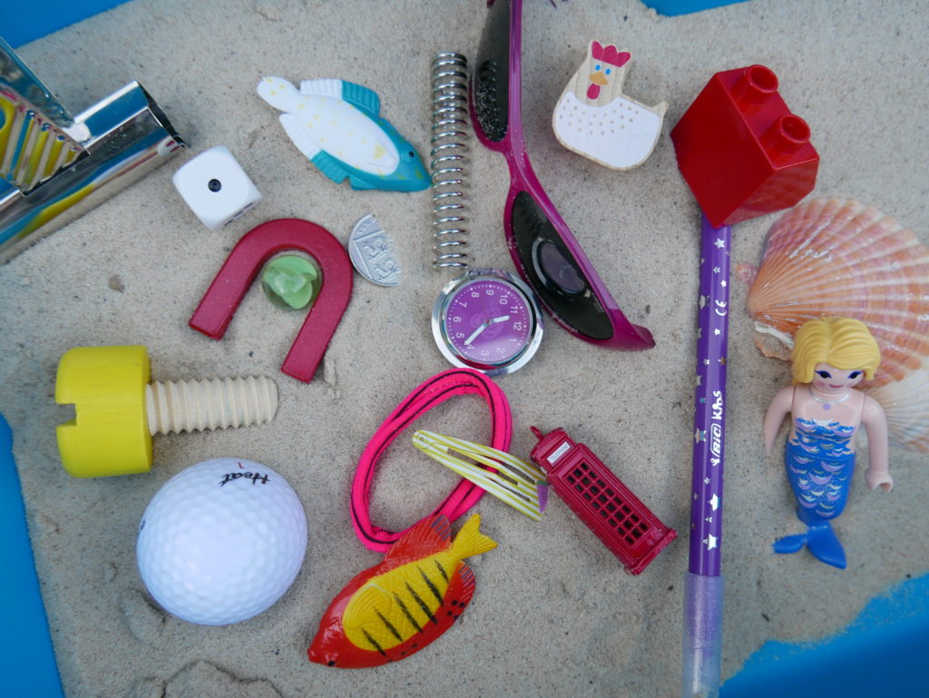 collection of random objects to sort as a materials activity linked to The Little Mermaid